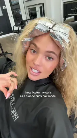 A post by @avari_lanai on TikTok caption: my most asked question #curlyhair #curls #blonde 