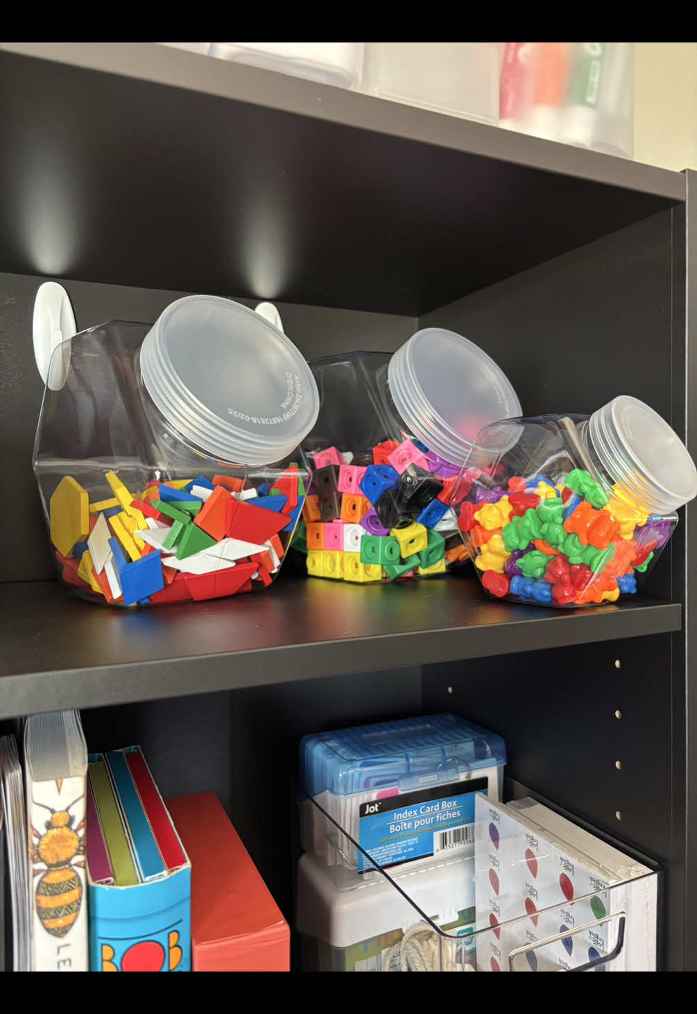 A post by @themindfulmama_ on TikTok caption: A great option if you’re needing extra homeschool storage!✨😌🖍️✏️📓 #smallhomeschoolspace #homeschoolorganization #kindergartenhomeschool #secularhomeschool #homeschoolstorage 
