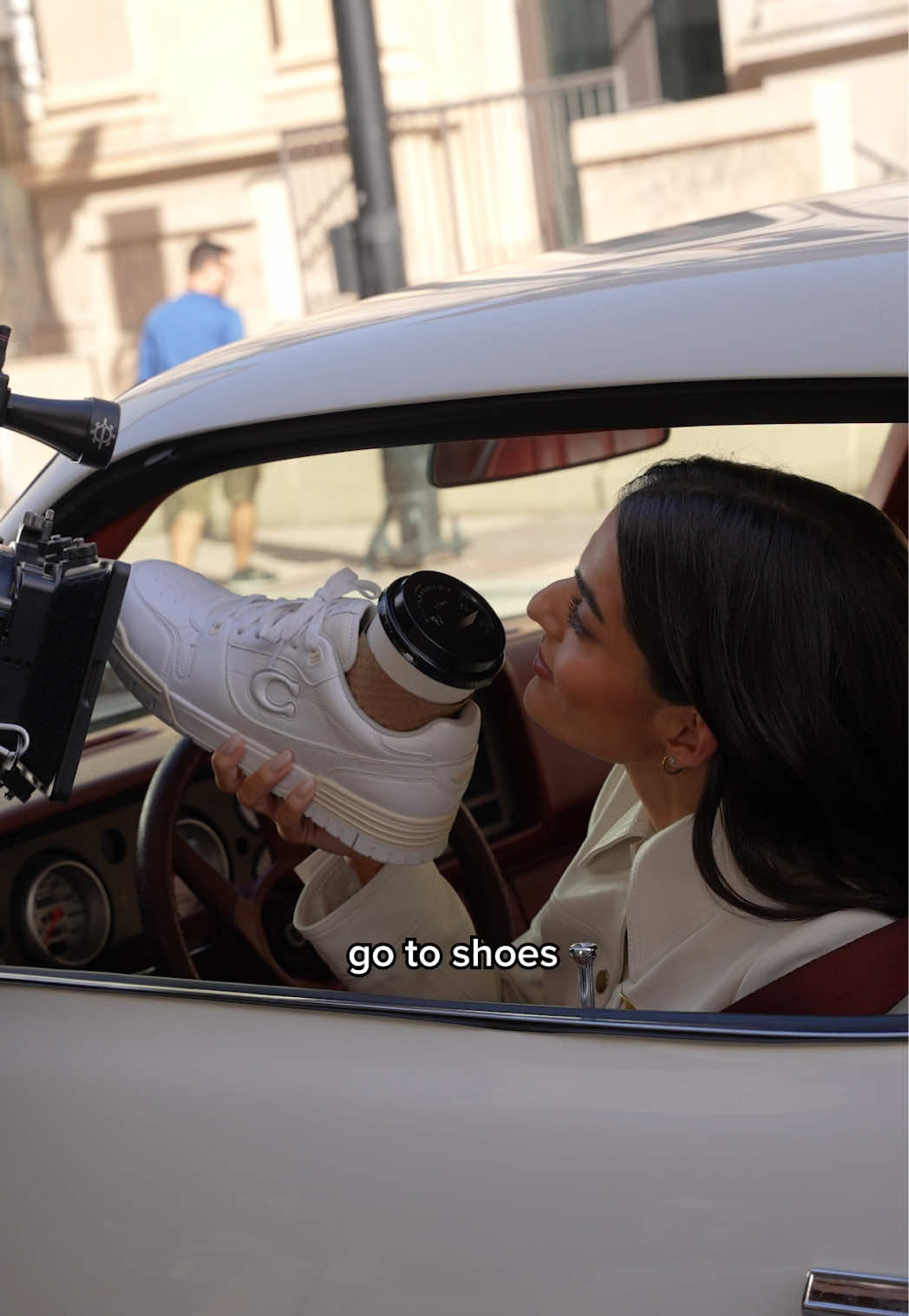 A post by @coach on TikTok caption: 🏁Ready, set, kick it with @tonibreidinger & her chill day must-haves. What are yours? 👟 #CoachNY #SohoSneaker #EverydayShoes