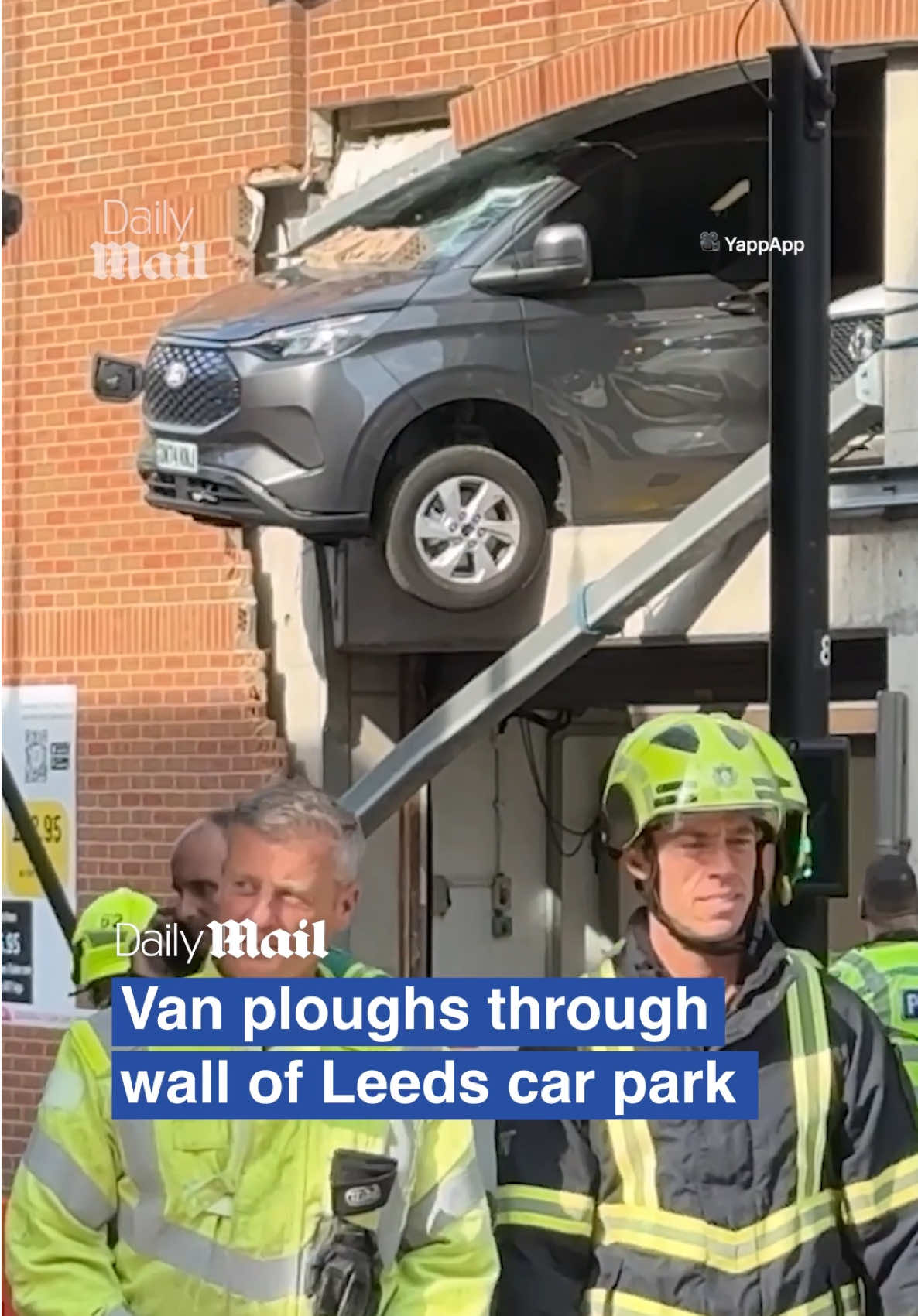 A post by @dailymailuk on TikTok caption: A van has ploughed through a car park wall on Wednesday - sending falling rubble tumbling onto pedestrians below.  Five people were rushed to hospital, including two people in the van which smashed through a car park wall in Leeds city centre. The van was left dangling from the second floor of the building as emergency services were called to the scene at around 4.10pm. #leeds #car #carcrash #van #carpark #news 