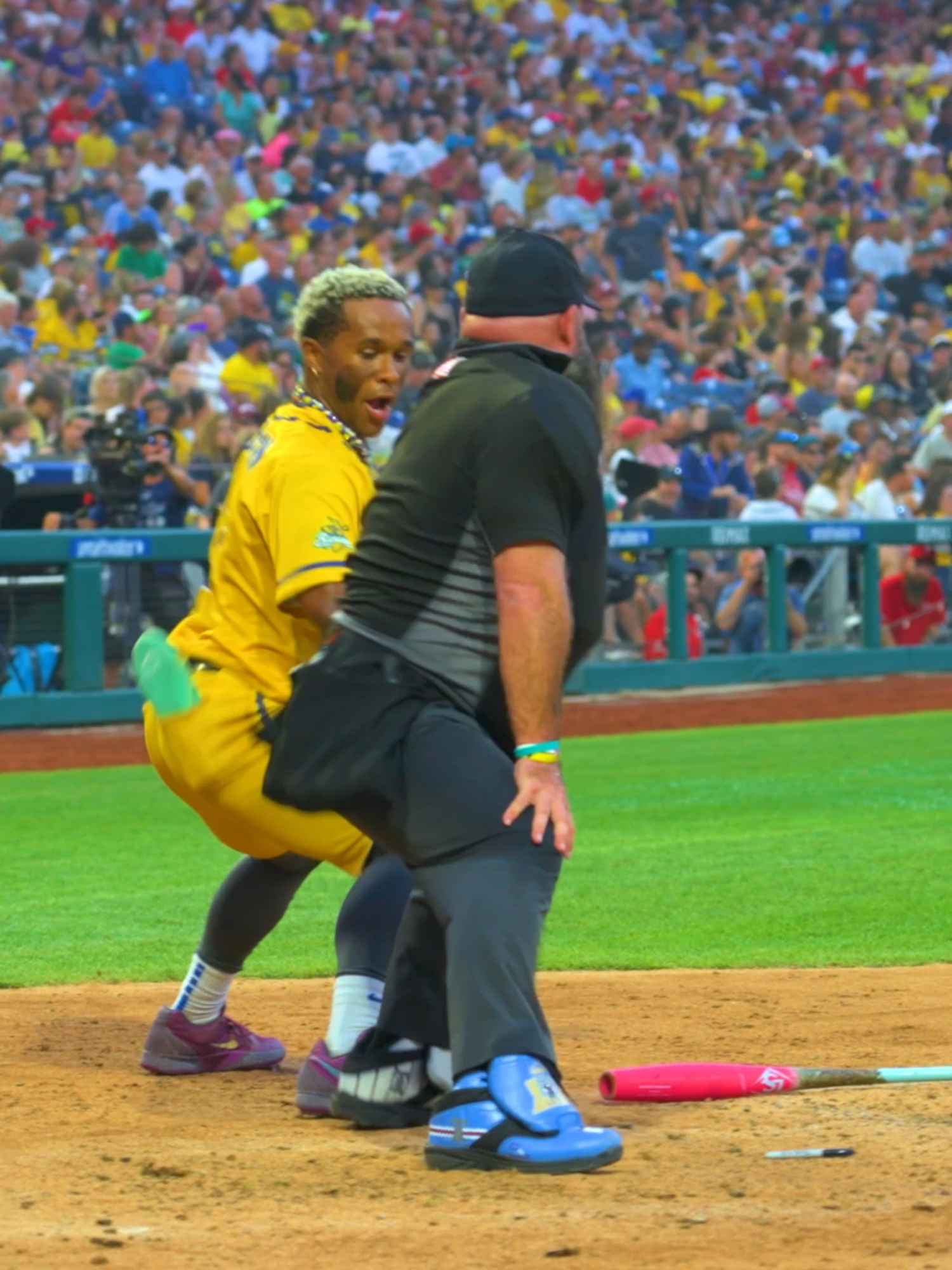 A post by @thesavbananas on TikTok caption: Let's be real, did we expect anything else to happen? @tyy2flyy @dancingumpire #savannahbananas #bananaball #foryoupage #baseball #umpire