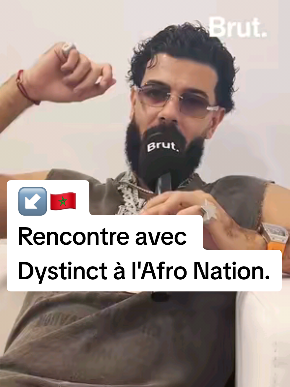 A post by @brutafrique on TikTok caption: 🇲🇦 "Je veux que le monde entier chante en darija." S'il fait de la musique, c'est aussi pour promouvoir la culture marocaine à travers le monde. Nous avons rencontré @dystinctofficial à l’Afro Nation 2025, il nous a parlé de son univers musical et de son attachement au Maroc. #afrique #culture #maroc #musique #afronation