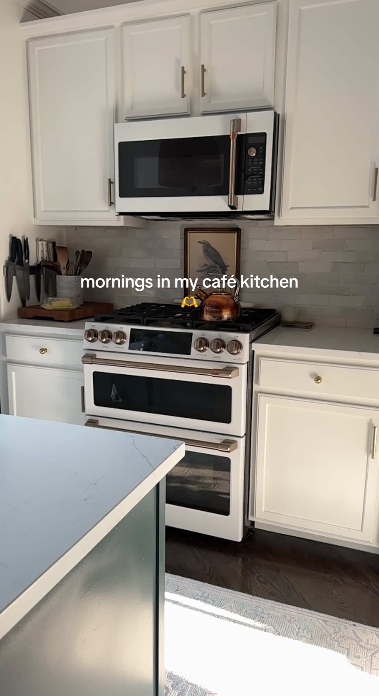 A post by @cozyinchicago on TikTok caption: #ad Cozy mornings are my favorite kind in my CAFÉ kitchen. Mornings are just a bit brighter and definitely more beautiful when I get to make breakfast at home.  I'm obsessed with my CAFÉ Matte White appliances that make this space feel even more serene, blending seamlessly with the soft tones in my kitchen and adding the perfect touch of warmth and style. I love that you can customize @Cafe Appliances from their three finishes, Matte White, Matte Black and Stainless Steel, to their six complementary hardware options based on your style preferences.  Here’s to more mornings that start like this with cafe appliances. #cafepartner #homedecor #cozyathome #kitchendesign #morningvlog 