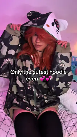 A post by @rainsonline on TikTok caption: 🎀 #ad #sponser #hoodie #hellokitty #fentysuperbrandday #06 #hehim #fem #fashion #camo #femboy #crossdresser #crossdressing #crossdressermodel #model #modeling #crossdress #OOTD #outfit #fit #FitCheck #outfitcheck #alt #Aesthetic #y2k 