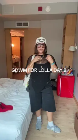 A post by @isa_kristen22 on TikTok caption: get dressed with me for lollapolooza day 2 🤭✨ outfit details: poncho @Amazon  shorts @American Eagle  shoes @New Balance  jewelry Amazon   hat @aliceandwonder  glasses @Elisajohnson  @snif.co @Juliette has a gun  tank top @Klassy Network  @Ulta Beauty  #gdwm #getdressedwithme #lollapolooza #chicago #festivaloutfits 