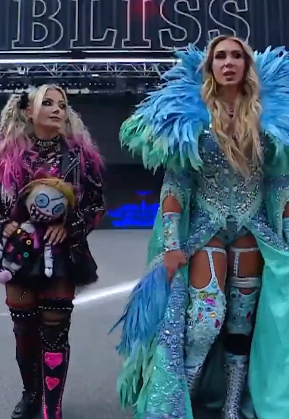 A post by @wwe on TikTok caption: name a more iconic duo… we’ll wait 🤝 #WWE #SummerSlam #AlexaBliss #CharlotteFlair