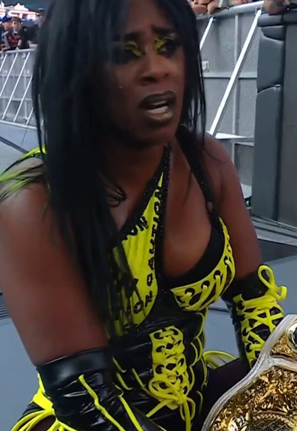 A post by @wwe on TikTok caption: CAUTION: We have a WINNER! ⚠️🏆 #WWE #SummerSlam #RheaRipley #IYOSKY #Naomi 