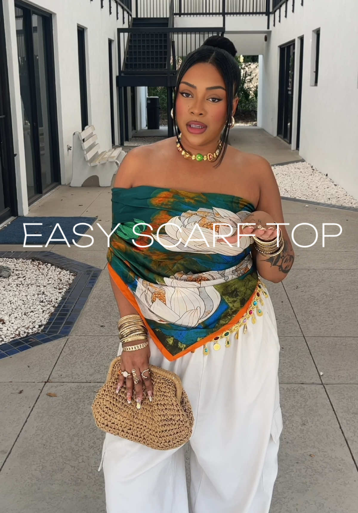 A post by @exe_eve on TikTok caption: Scarves are easily one of the most versatile pieces you can own! Just another simple and easy way to style a scarf as a top. 💚🧡🤍 #scarftop #scarftutorial #scarfhack #clotheshacks #fashionhacks #DIY #outfithacks 
